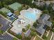 A comprehensive aerial view of the community pool area, complete with multiple pools, slides, and recreational spaces at 212 Preatonwood Dr, Apex, NC 27539