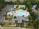 Overhead view of the community amenities highlighting the pool, water park, clubhouse, and tennis courts at 212 Preatonwood Dr, Apex, NC 27539