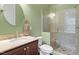 Bathroom features a marble vanity, toilet, and glass shower with marble tile surround at 212 Preatonwood Dr, Apex, NC 27539