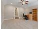 Neutral bedroom with a ceiling fan, a window, and a carpeted floor at 212 Preatonwood Dr, Apex, NC 27539