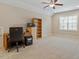 Neutral bedroom with a ceiling fan, a window, and a carpeted floor at 212 Preatonwood Dr, Apex, NC 27539