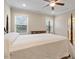 Bedroom featuring a four-poster bed, a dresser, and natural light from two windows at 212 Preatonwood Dr, Apex, NC 27539