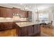 Well-appointed kitchen with granite counters, stainless appliances, and open layout at 212 Preatonwood Dr, Apex, NC 27539