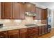 Detailed kitchen with stainless steel appliances, granite countertop, and custom cabinets at 212 Preatonwood Dr, Apex, NC 27539
