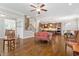 Spacious living room featuring hardwood floors, open floor plan, and access to the kitchen at 212 Preatonwood Dr, Apex, NC 27539
