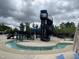 Resort-style community pool with a winding lazy river and spiral water slide for aquatic fun at 212 Preatonwood Dr, Apex, NC 27539