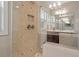 Modern shower with beautiful tilework, glass enclosure, and updated fixtures at 212 Preatonwood Dr, Apex, NC 27539