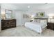 Serene main bedroom with neutral decor, plush carpet, and ample natural light at 220 Gianna Dr, Lillington, NC 27546
