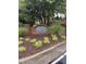 Delaney Crossing community sign surrounded by lovely landscaping near sidewalk at 2221 Delaney Dr # 112, Burlington, NC 27215