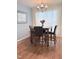 Dining room with wooden table and chairs, a chandelier, and natural light at 2221 Delaney Dr # 112, Burlington, NC 27215