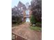 Charming brick building with manicured landscaping and a welcoming front entrance at 2221 Delaney Dr # 112, Burlington, NC 27215