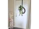 Front door adorned with a wreath and a welcome sign at 2221 Delaney Dr # 112, Burlington, NC 27215