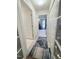 Hallway featuring multiple storage closets and glass doors leading to another room at 2221 Delaney Dr # 112, Burlington, NC 27215