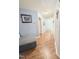 Inviting hallway featuring wood-look flooring and freshly painted light blue walls at 2221 Delaney Dr # 112, Burlington, NC 27215
