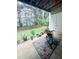 Secluded patio overlooking the backyard, furnished with potted plants and a small table at 2221 Delaney Dr # 112, Burlington, NC 27215