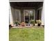 Landscaped patio featuring vibrant potted plants, creating a serene outdoor living space at 2221 Delaney Dr # 112, Burlington, NC 27215