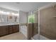 Luxurious bathroom featuring a soaking tub, walk-in shower, and double vanity at 238 Langford Valley Way, Cary, NC 27513