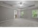Spacious primary bedroom with tray ceiling, neutral carpet, and ensuite bath at 238 Langford Valley Way, Cary, NC 27513