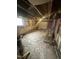 Unfinished basement featuring walls, unfinished floor and ladder at 2507 Chapel Hill Rd, Durham, NC 27707