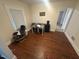 Bedroom has hardwood floors and a window, with view of the outside at 2507 Chapel Hill Rd, Durham, NC 27707