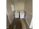 A dedicated laundry room with white flooring and standard washing machine and dryer at 2507 Chapel Hill Rd, Durham, NC 27707