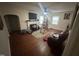 Living room with fireplace, ceiling fan, hardwood floors, and natural light at 2507 Chapel Hill Rd, Durham, NC 27707