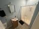 Bathroom featuring a shower-tub combo, vanity, and neutral tiling at 2509 Chapel Hill Rd, Durham, NC 27707