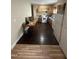 Galley kitchen with wood cabinets, appliances, and access to hardwood floor area at 2509 Chapel Hill Rd, Durham, NC 27707