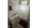 Bright bathroom featuring a tub and shower, vanity sink, and classic fixtures at 2511 Chapel Hill Rd, Durham, NC 27707