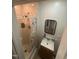Cozy bathroom featuring a shower, vanity sink with mirror, and storage at 2511 Chapel Hill Rd, Durham, NC 27707