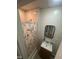 Cozy bathroom featuring a shower, vanity sink with mirror, and storage at 2511 Chapel Hill Rd, Durham, NC 27707
