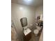 Practical bathroom with a vanity sink, square mirror, toilet, and a tiled shower at 2511 Chapel Hill Rd, Durham, NC 27707