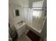 Bright bathroom featuring a tub and shower, vanity sink, and classic fixtures at 2511 Chapel Hill Rd, Durham, NC 27707