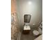 Practical bathroom with a vanity sink, square mirror, toilet, and a tiled shower at 2511 Chapel Hill Rd, Durham, NC 27707