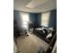 Bedroom with natural light, blue walls, and carpet at 2511 Chapel Hill Rd, Durham, NC 27707