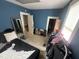 Bedroom featuring blue walls, carpet and two closets for optimal storage at 2511 Chapel Hill Rd, Durham, NC 27707