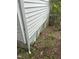 Exterior house siding with visible damage and overgrown foliage at 2511 Chapel Hill Rd, Durham, NC 27707