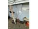 The exterior of a building with an unkempt garden and items at 2511 Chapel Hill Rd, Durham, NC 27707