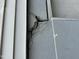 Close up of the exterior showing cracks and damage to the siding at 2511 Chapel Hill Rd, Durham, NC 27707