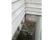 Close up of the side of a house with visible utilities and peeling paint at 2511 Chapel Hill Rd, Durham, NC 27707