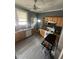 Efficient kitchen with stainless steel appliances, wooden cabinets, and a bright window at 2511 Chapel Hill Rd, Durham, NC 27707