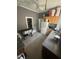 Practical kitchen with essential appliances, wood cabinetry, and durable laminate flooring at 2511 Chapel Hill Rd, Durham, NC 27707
