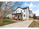 Beautiful two-story home featuring a covered front porch and a well-maintained lawn at 2517 Newbold St, Raleigh, NC 27603