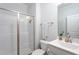 Bright bathroom with a glass-enclosed shower, modern fixtures, and a clean, minimalist design at 2521 Heathland Farm Dr, Fuquay Varina, NC 27526