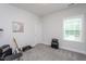 Carpeted bedroom with window and closet, perfect for a music enthusiast at 2521 Heathland Farm Dr, Fuquay Varina, NC 27526