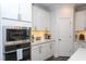 Kitchen showing stainless appliances and sleek cabinetry, creating an ideal cooking space at 2521 Heathland Farm Dr, Fuquay Varina, NC 27526