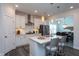 Bright kitchen with quartz countertops, stainless steel appliances, and stylish pendant lighting at 2521 Heathland Farm Dr, Fuquay Varina, NC 27526