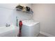 This practical laundry room features a utility sink, washer, dryer, and ample storage space at 2521 Heathland Farm Dr, Fuquay Varina, NC 27526