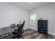 Bright office space with modern desk and chair with laminate wood flooring at 2521 Heathland Farm Dr, Fuquay Varina, NC 27526
