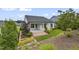 Well-maintained backyard featuring a covered patio, lush greenery, and beautiful landscaping at 2537 Cedar Hedge Ct, Apex, NC 27523